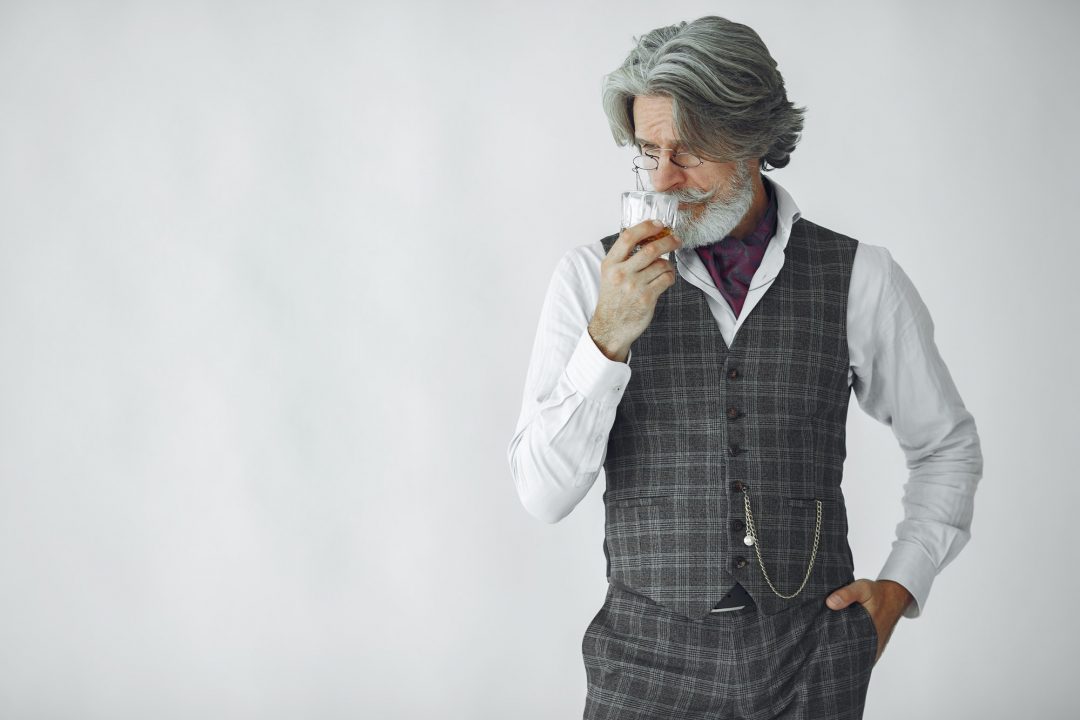 Handsome pensive mature businessman in formal suit